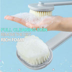 “Exfoliating shower brush with built-in liquid soap dispenser”